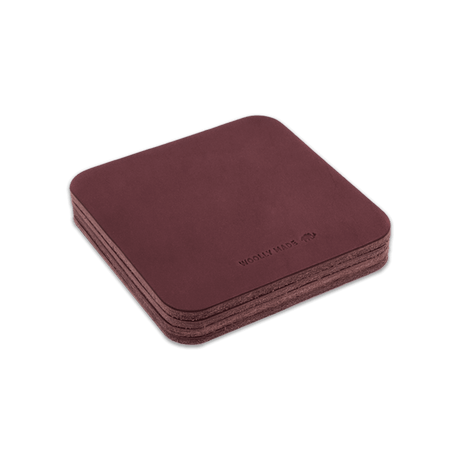 Burgundy leather square coaster set with hand-pressed Woolly Made logo stacked.