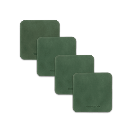 Green leather square coaster set with hand-pressed Woolly Made logo spread out.