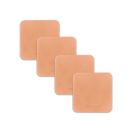 Natural leather square coaster set with hand-pressed Woolly Made logo spread out.