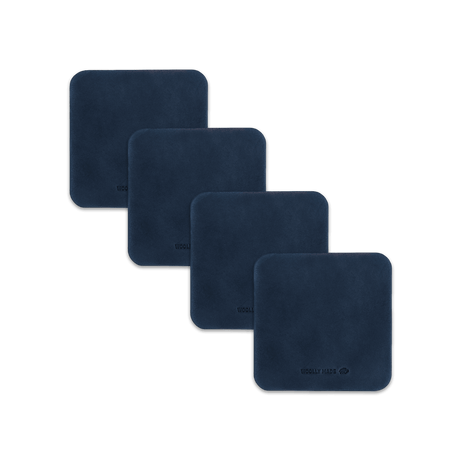 Navy leather square coaster set with hand-pressed Woolly Made logo spread out.