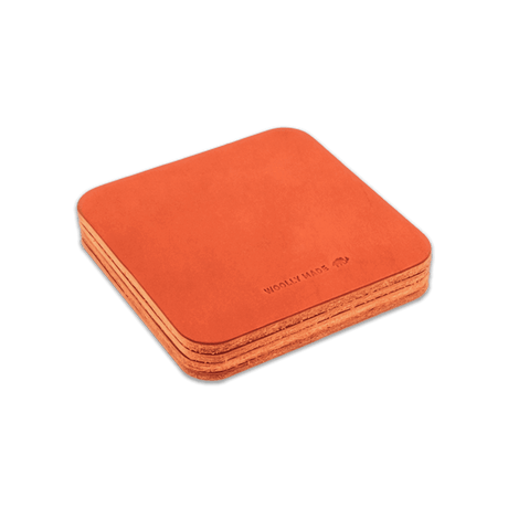 Orange leather square coaster set with hand-pressed Woolly Made logo stacked.