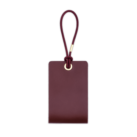  Woolly Made Standard Luggage Tag in Burgundy with elastic cord.