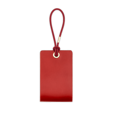 Woolly Made Standard Luggage Tag in Red with elastic cord.