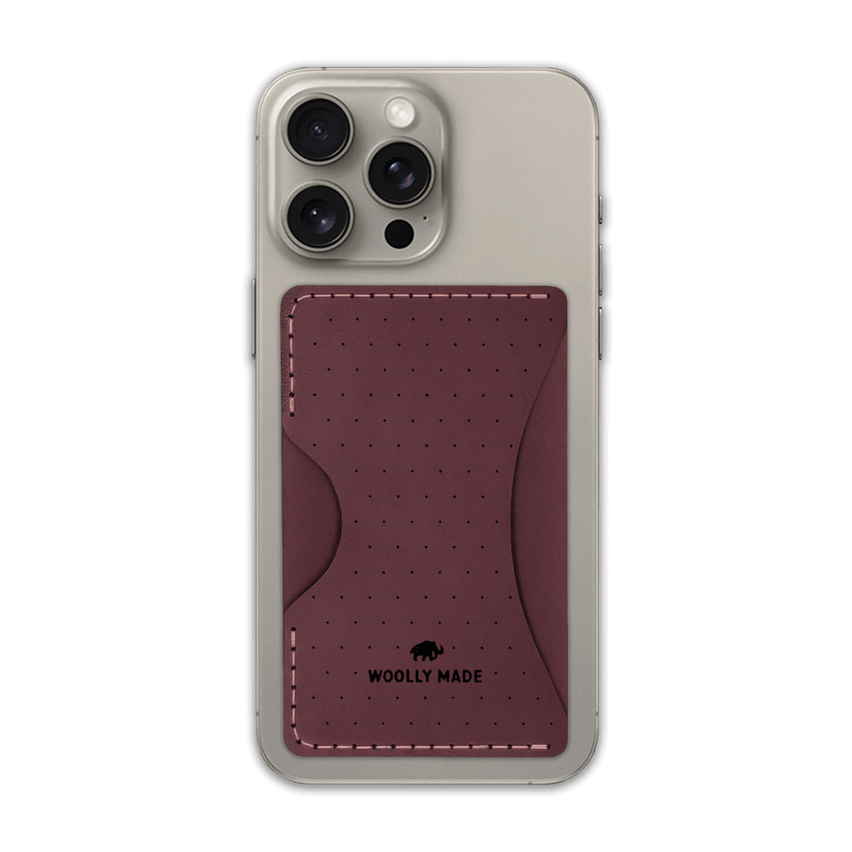 Burgundy leather Stick-On Wallet with decorative perforation and etched Woolly Made logo on iPhone.