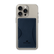 Navy leather Stick-On Wallet with decorative perforation and etched Woolly Made logo on iPhone.
