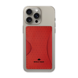 Red leather Stick-On Wallet with decorative perforation and etched Woolly Made logo on iPhone.