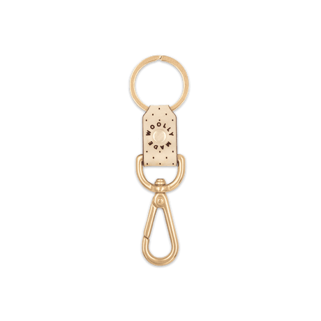 Tusk leather Swivel Keychain, decorative perforation, etched Woolly Made logo, brass hardware.