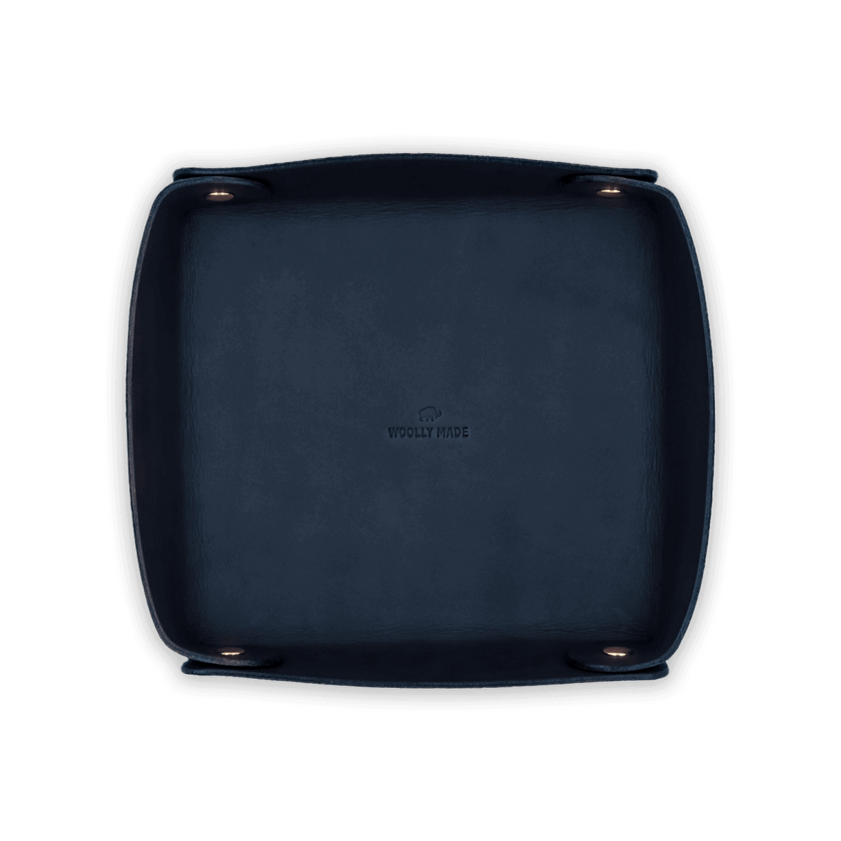 Top down view of navy leather Valet Tray with hand-pressed Woolly Made logo and brass hardware.