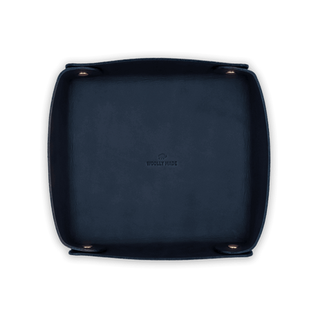 Top down view of navy leather Valet Tray with hand-pressed Woolly Made logo and brass hardware.