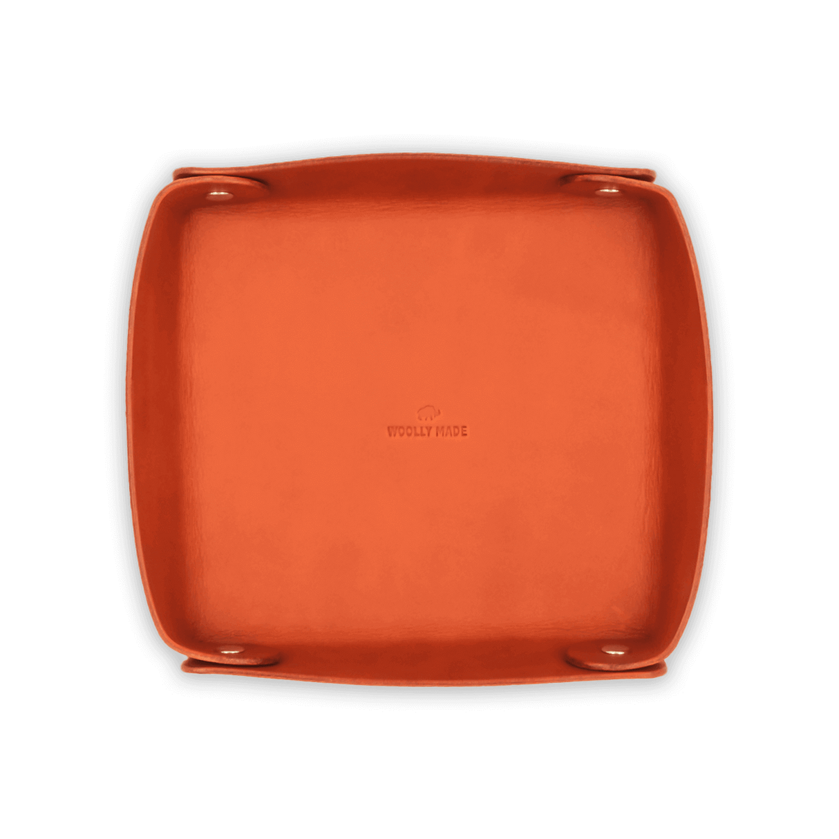 Top down view of orange leather Valet Tray with hand-pressed Woolly Made logo and brass hardware.