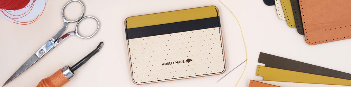 Yellow, black, and tusk Half Wallet with supplies.